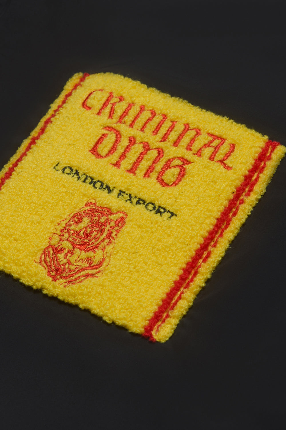 Close up of Criminal Damage logo on jacket 