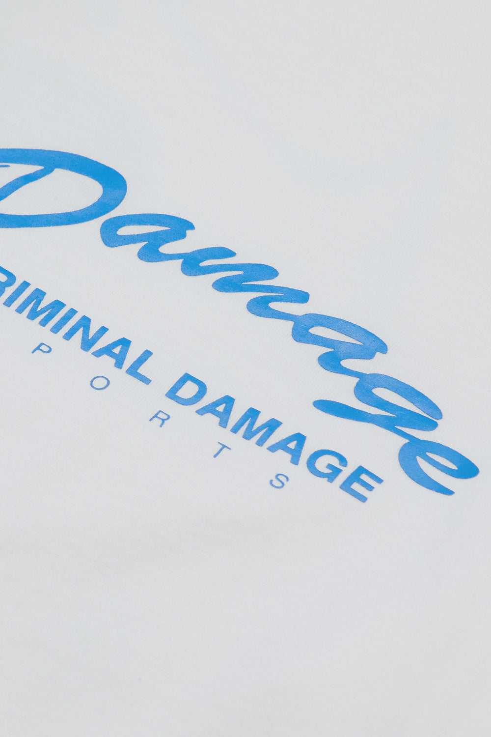 Close up of Criminal Damage logo on t-shirt