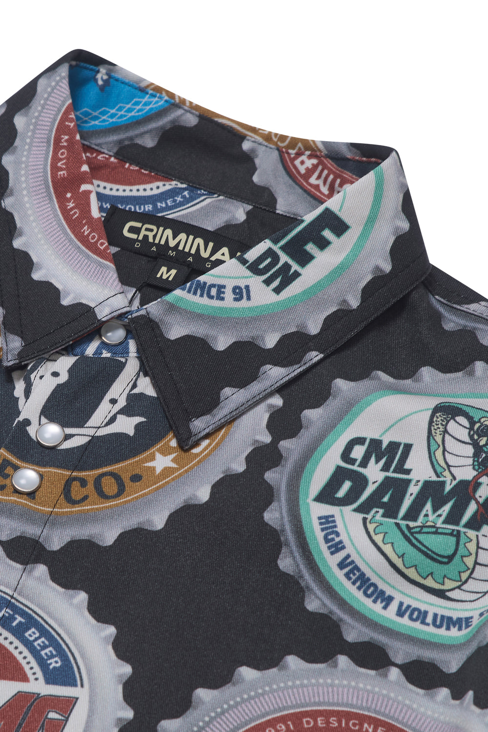Close up of Criminal Damage shirt with bottle cap graphic on white background