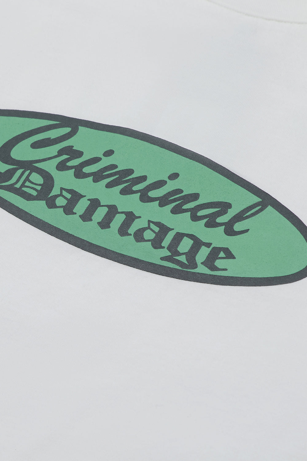 Close up of Criminal Damage graphic on t-shirt 