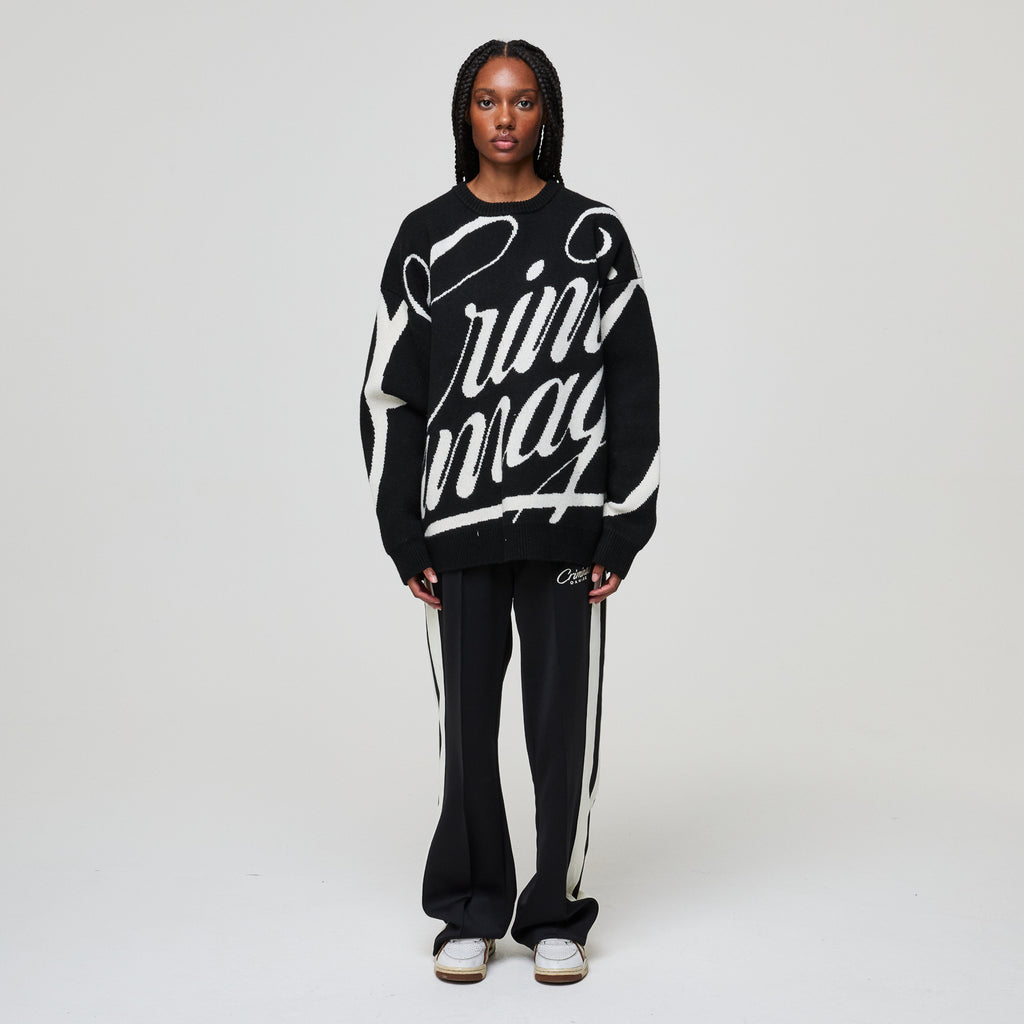 Person wearing a black and white outfit with 'rin may' branding on a plain background