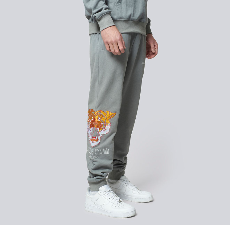 Criminal Damage grey sweatpants with a tiger logo and text 