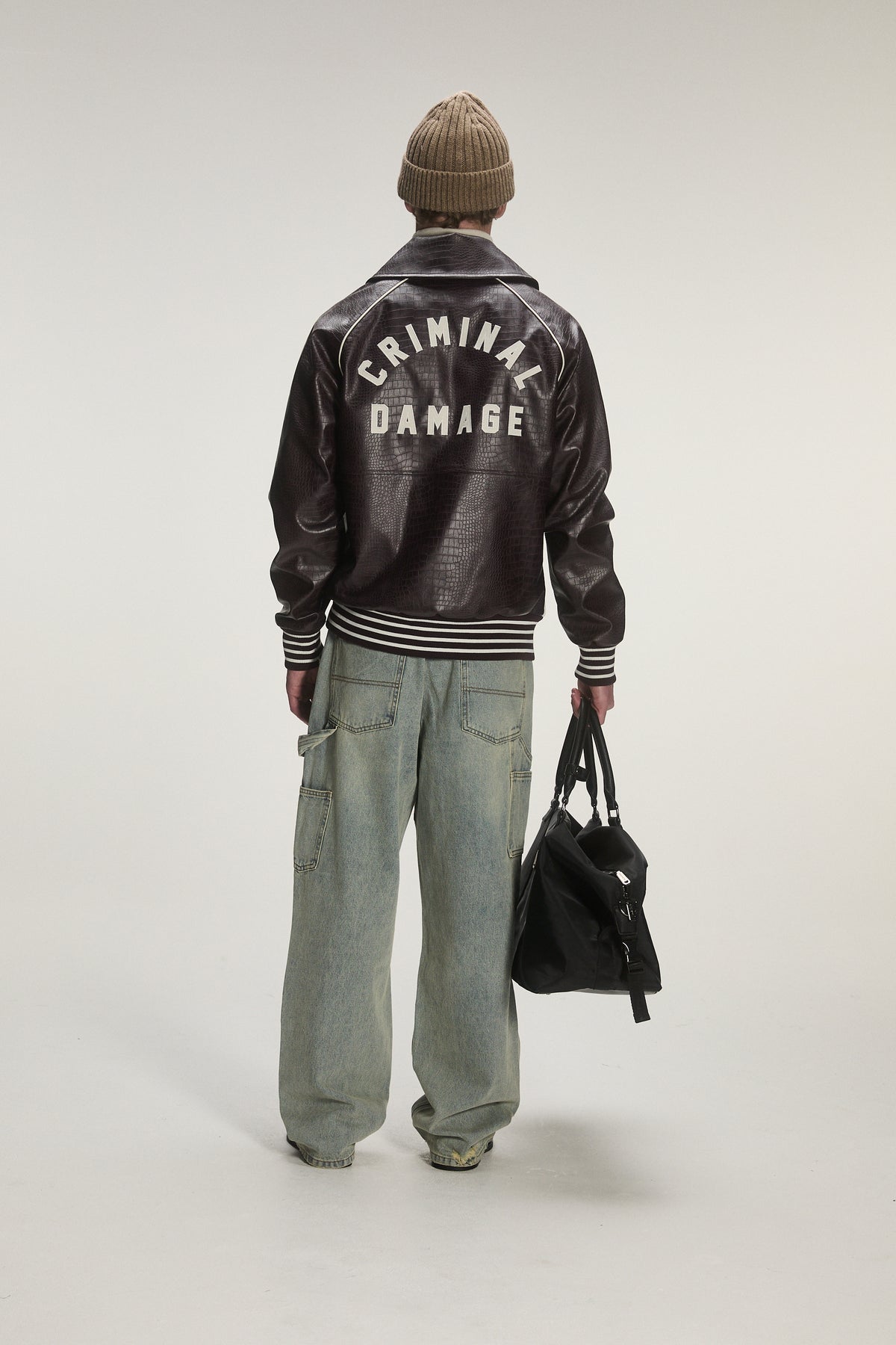 Male model wearing criminal damage 
