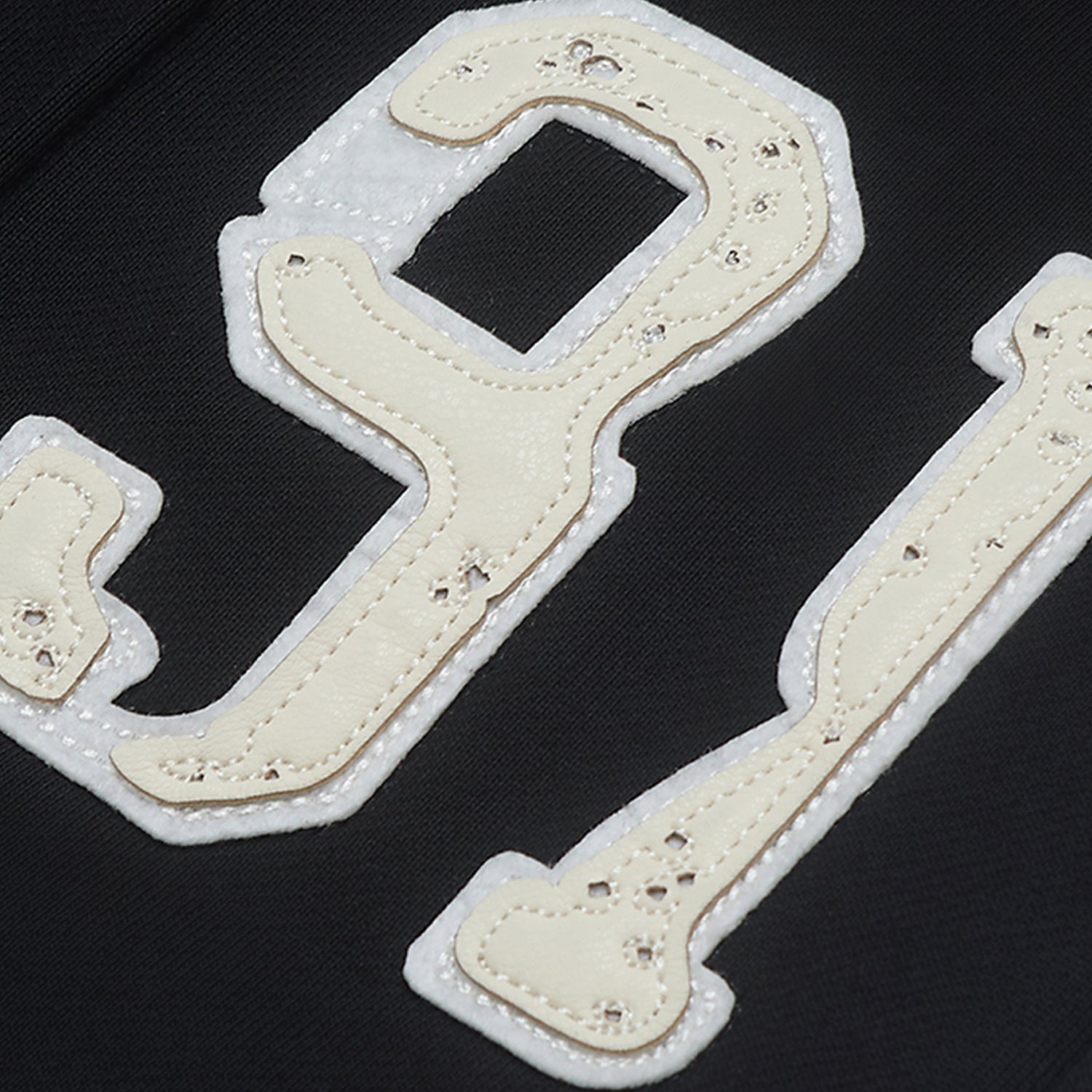 White bone-shaped patches on a black background