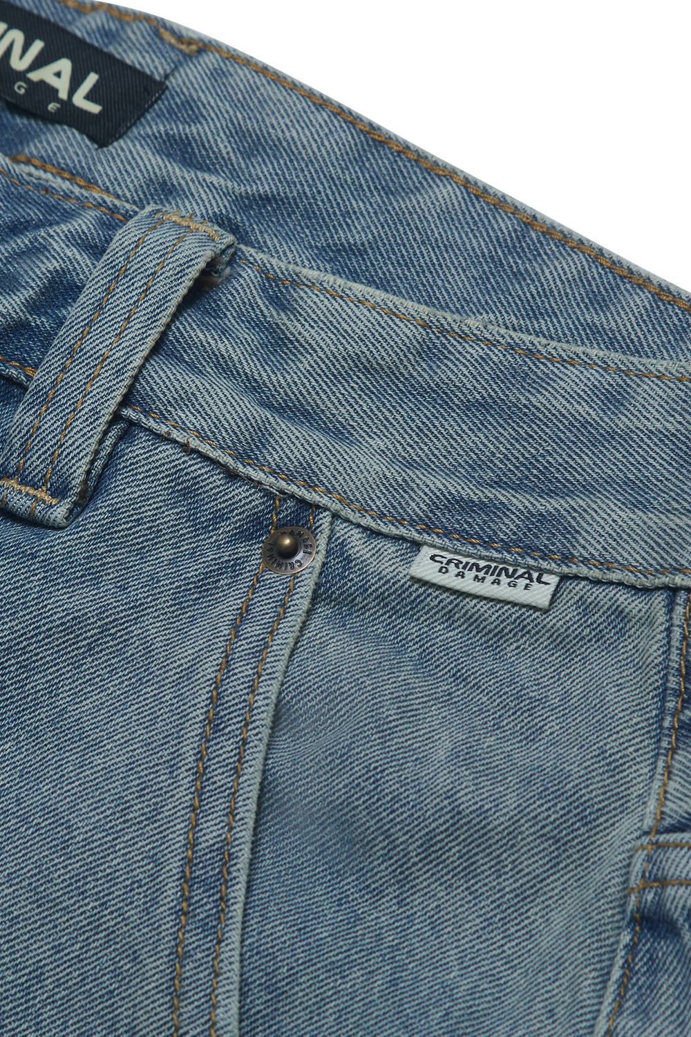 Close up of Criminal Damage denim jeans on white background