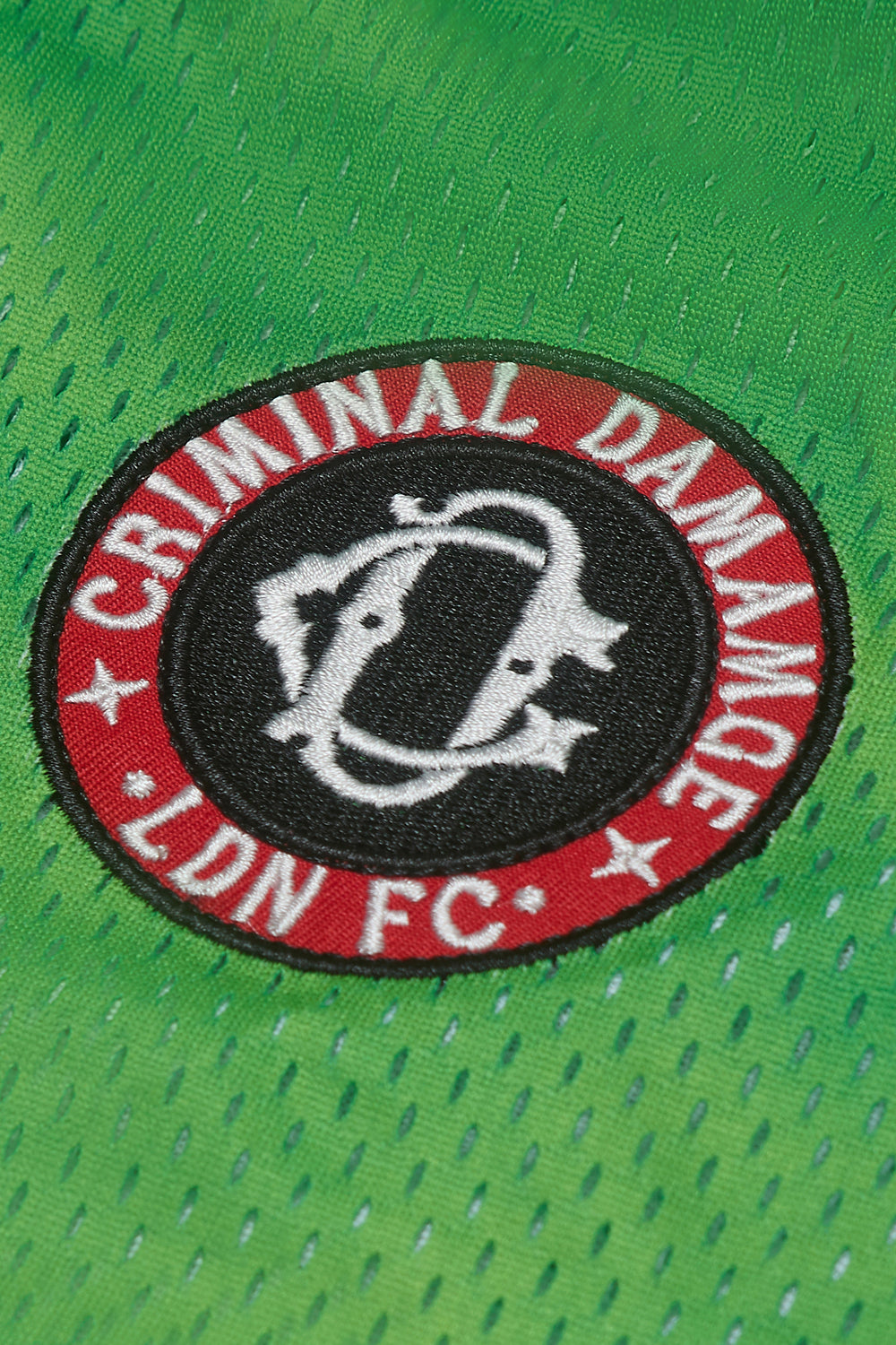 Close up of Criminal Damage logo patch on football shirt