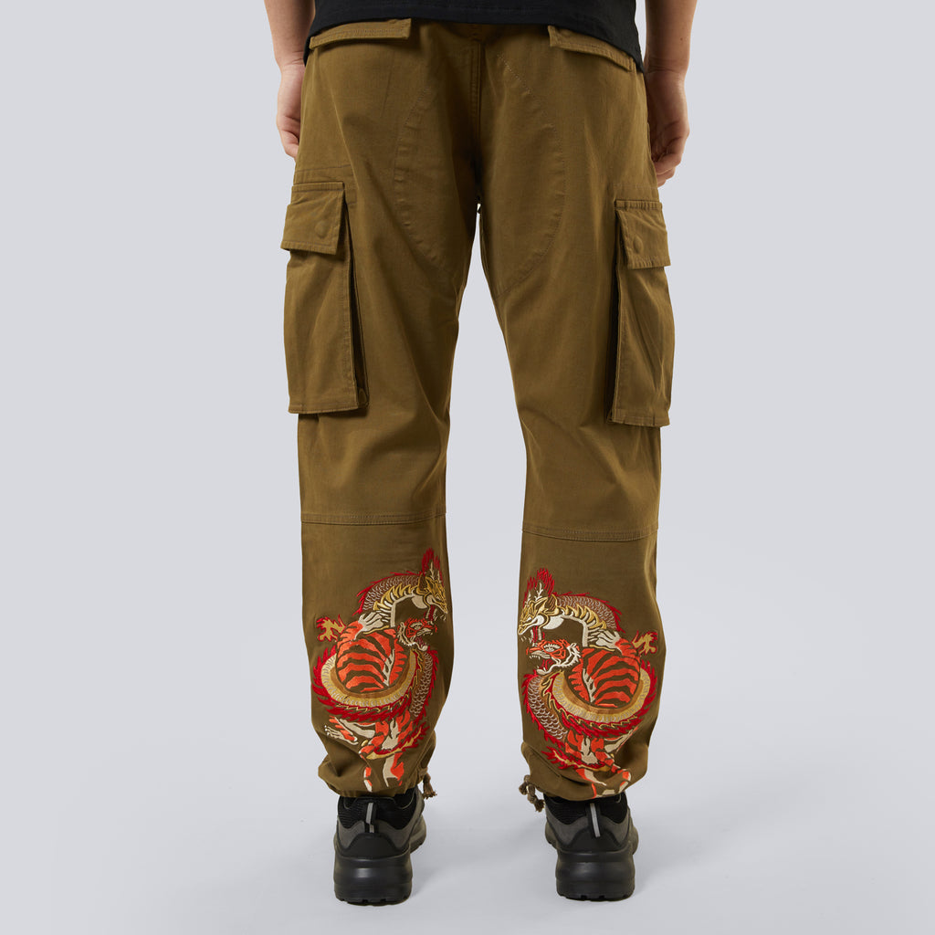 Brown cargo pants with dragon embroidery on a white background