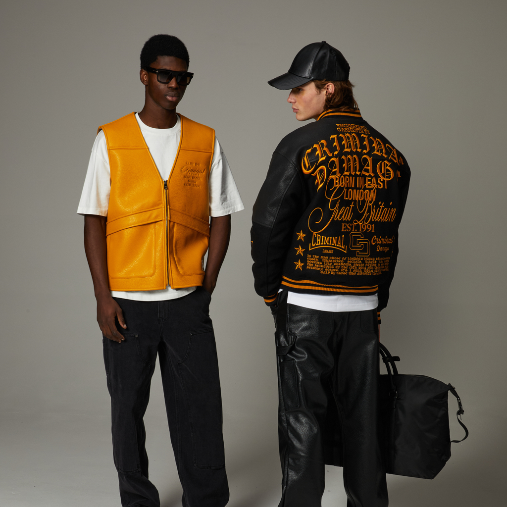 Two people wearing stylish Criminal Damage outfits with a grey background