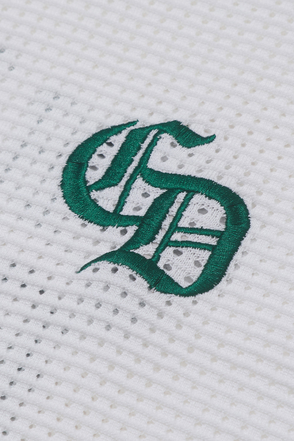 Close up of Criminal Damage embroidered logo 