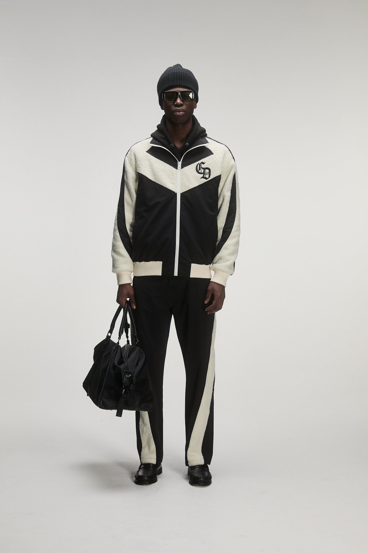 male model wearing criminal damage tracksuit 