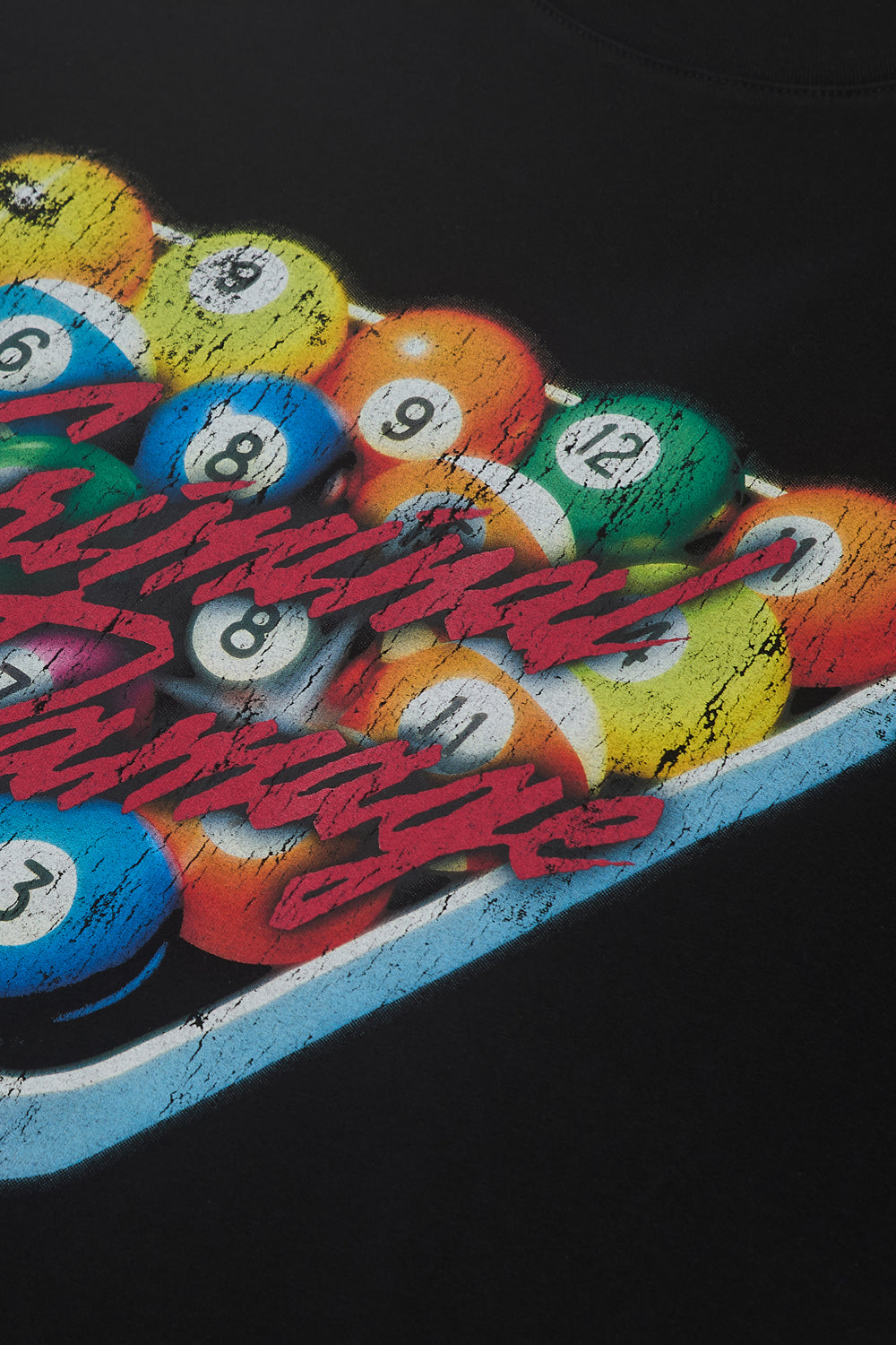 Close up of Criminal Damage graphic on t-shirt 