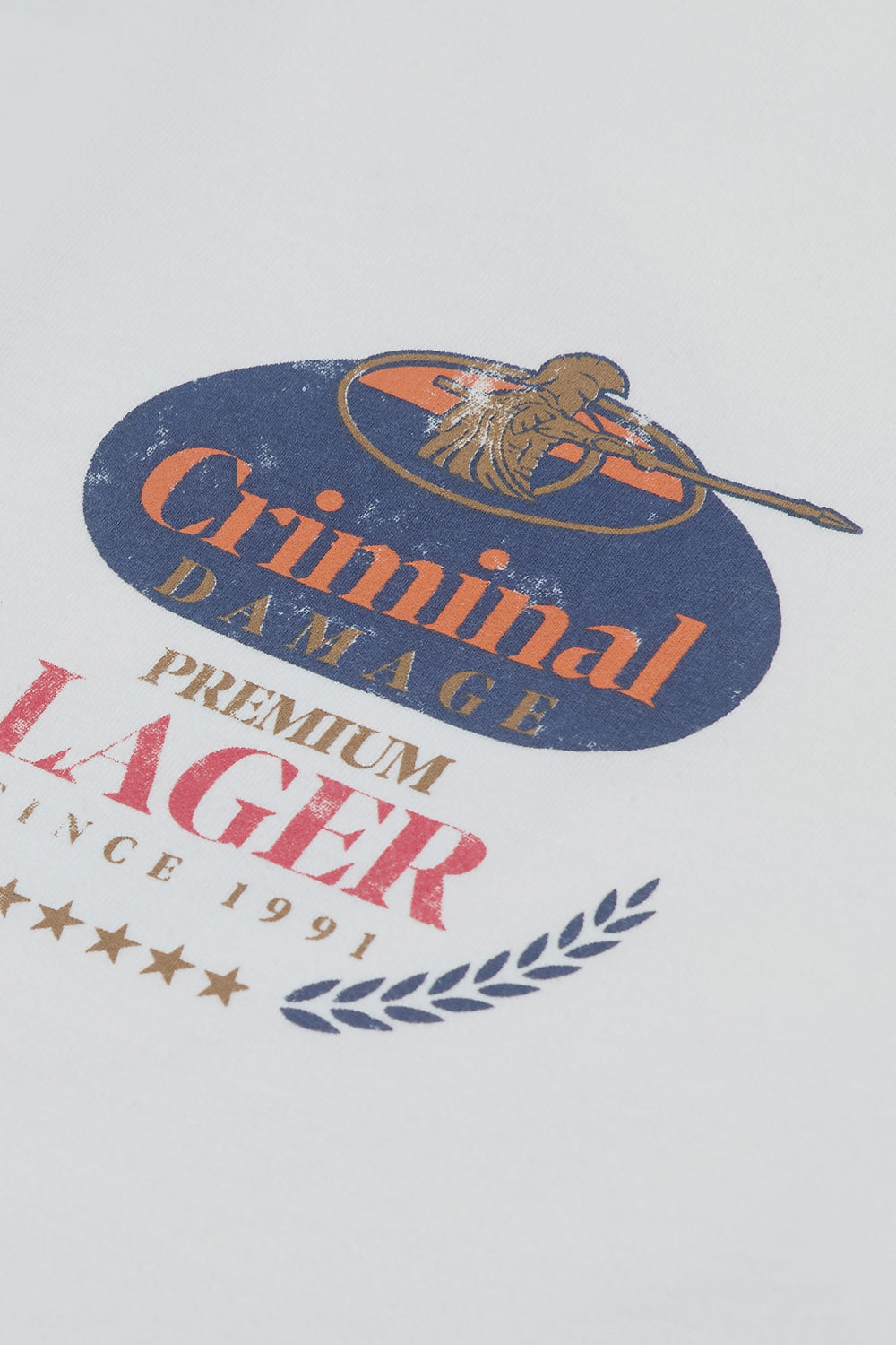 Close up of branding logo on Criminal Damage t-shirt