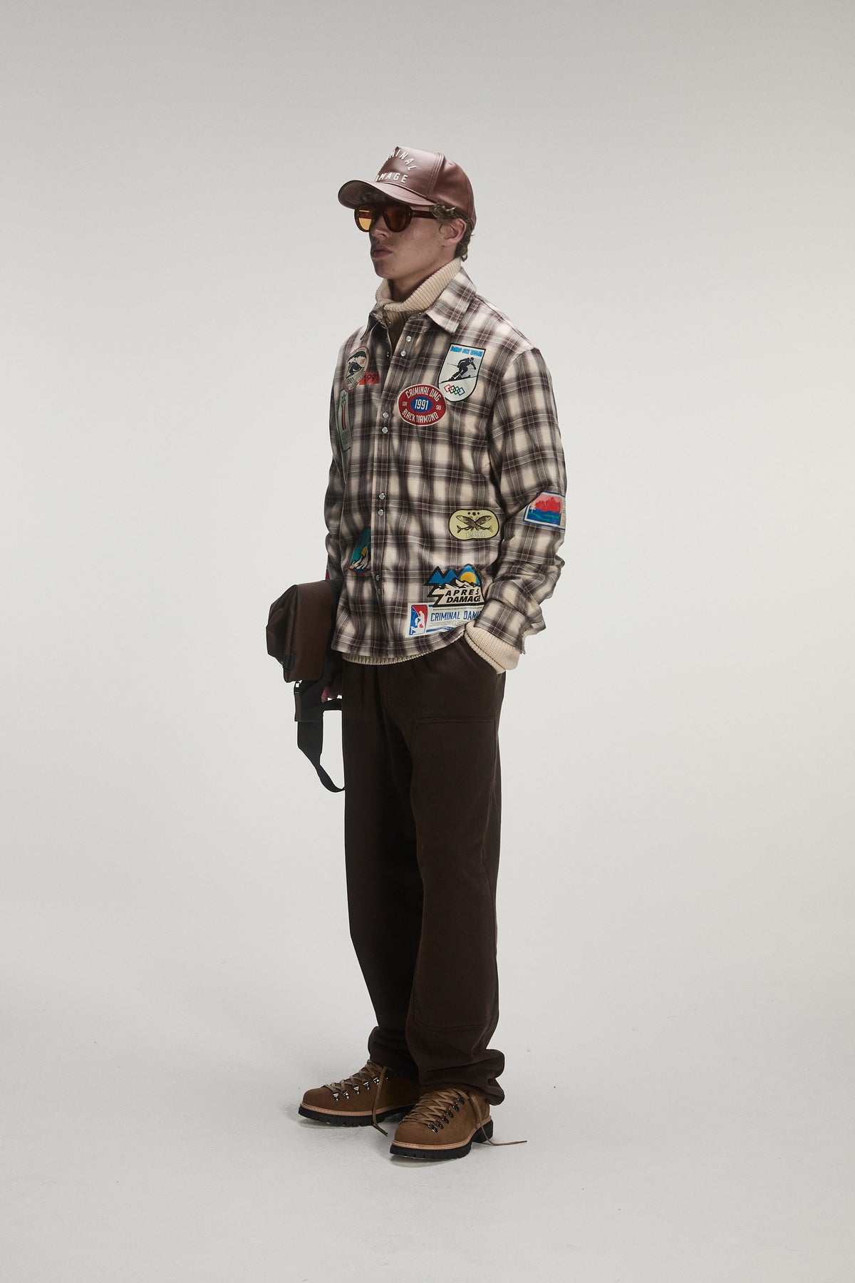 Male model wearing criminal damage shirt