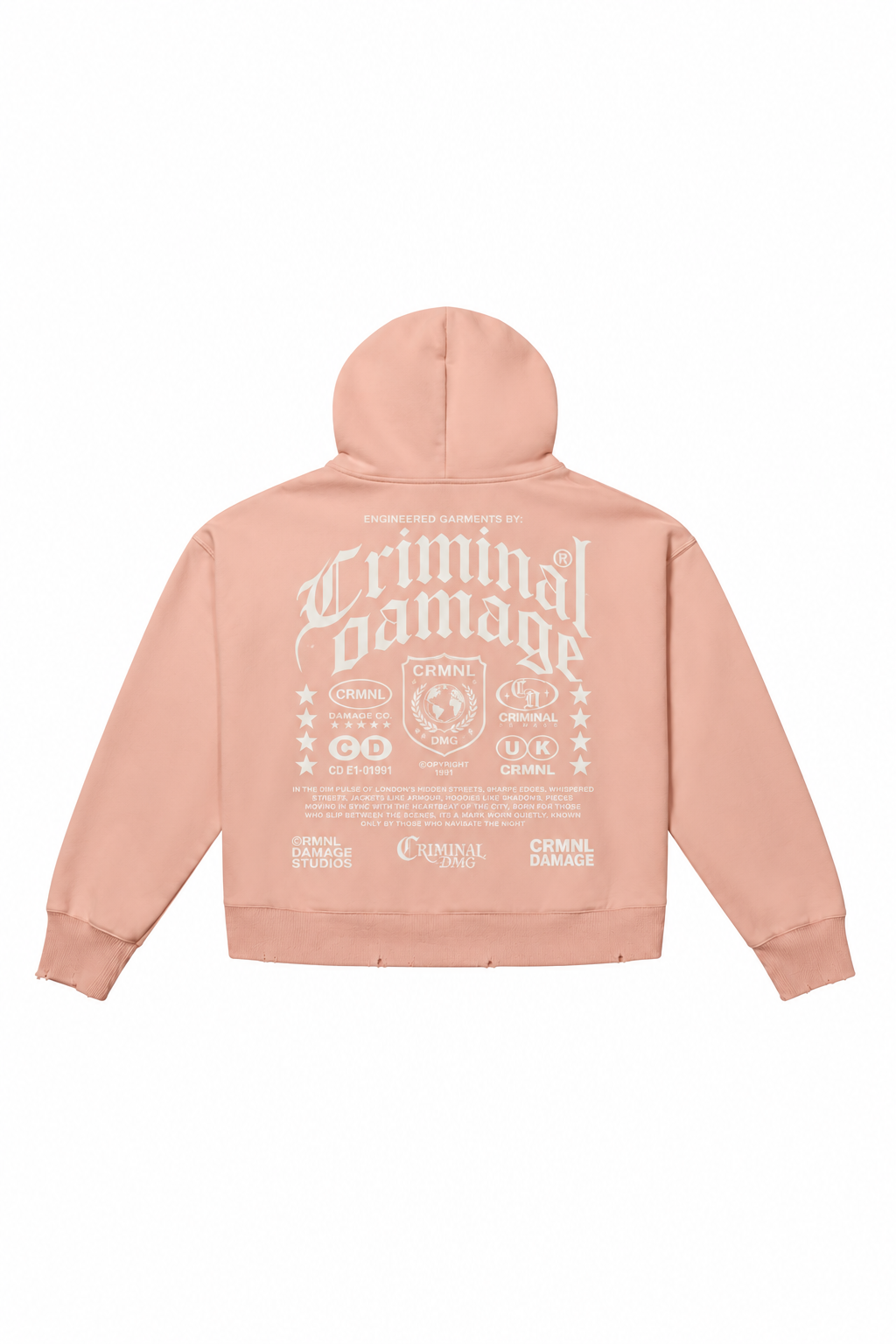 A light peach-pink cropped hoodie shown from the back, featuring a large distressed white graphic print that reads 'Criminal damage' with various emblem and text details.