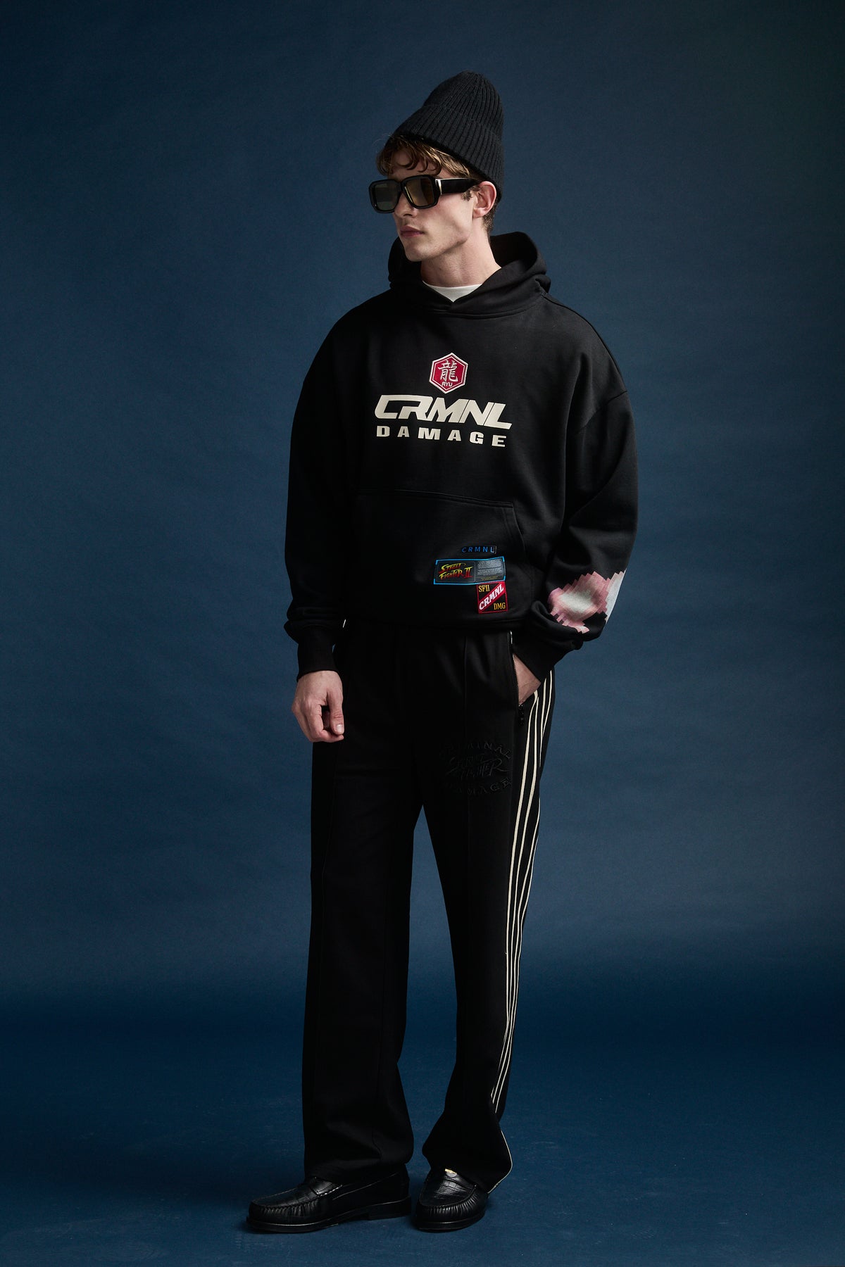Male model wearing Criminal Damage x Street Fighter hoodie