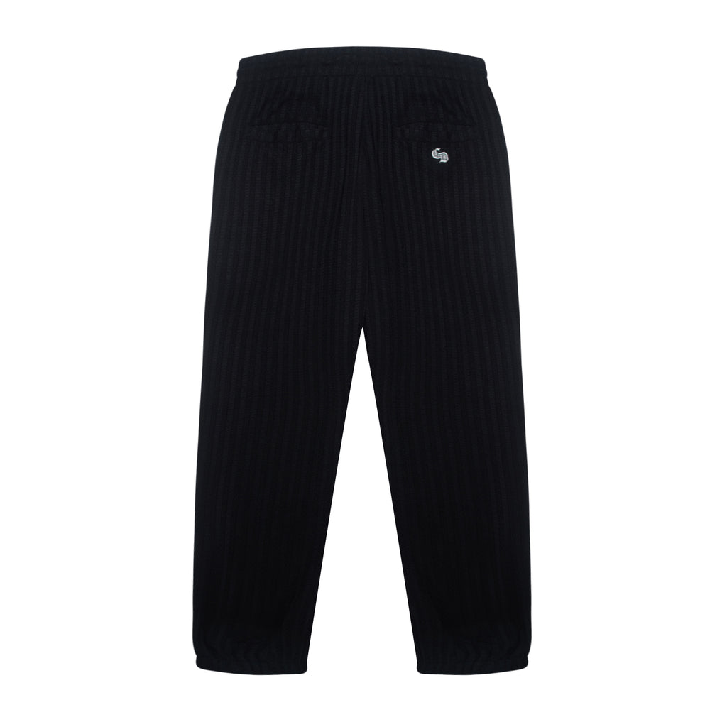 Black pants with a small logo on a white background
