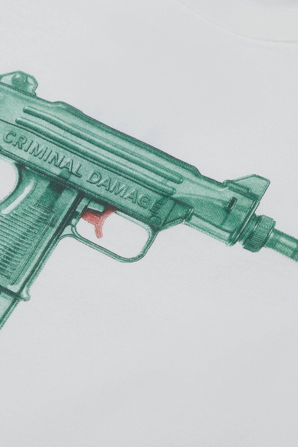 Close up of Criminal Damage water gun graphic on tshirt