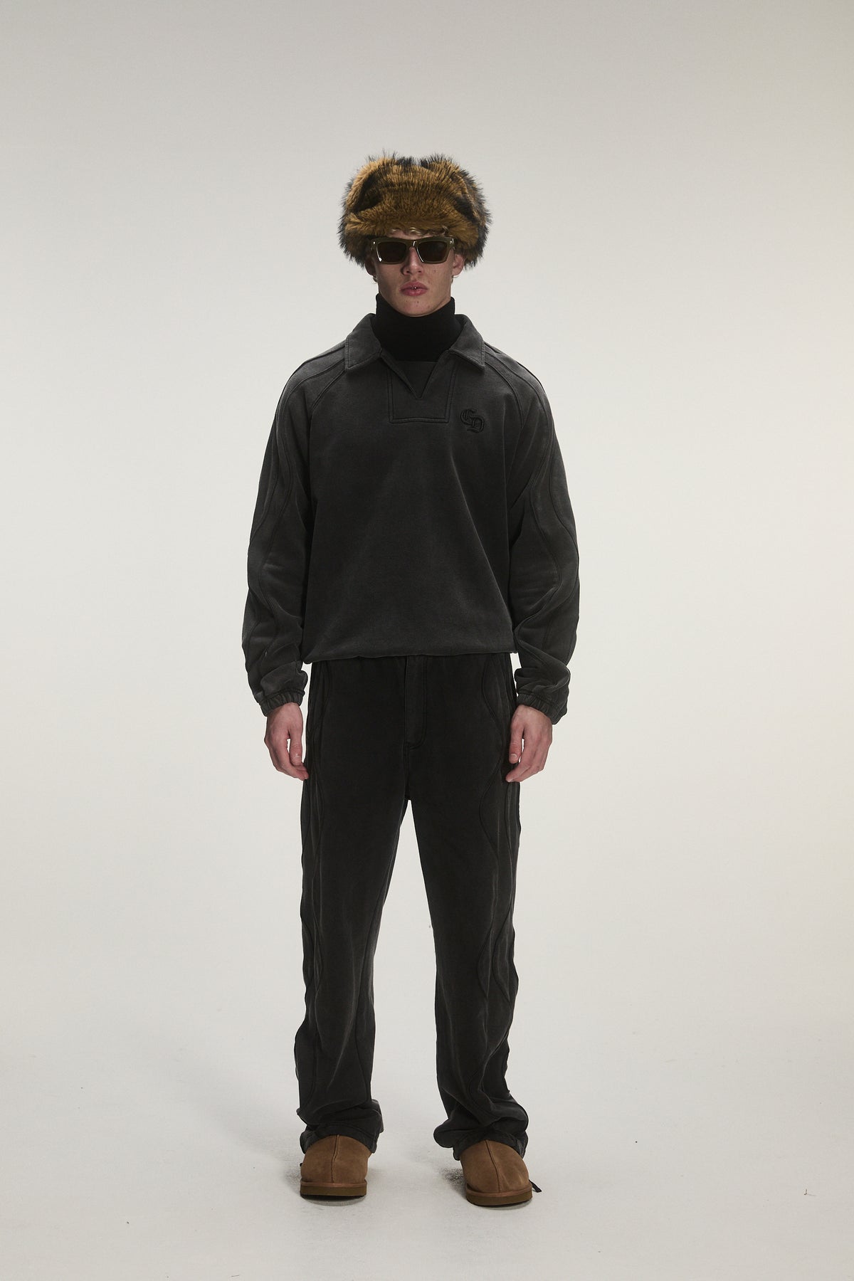 Male model wearing Criminal Damage training top 