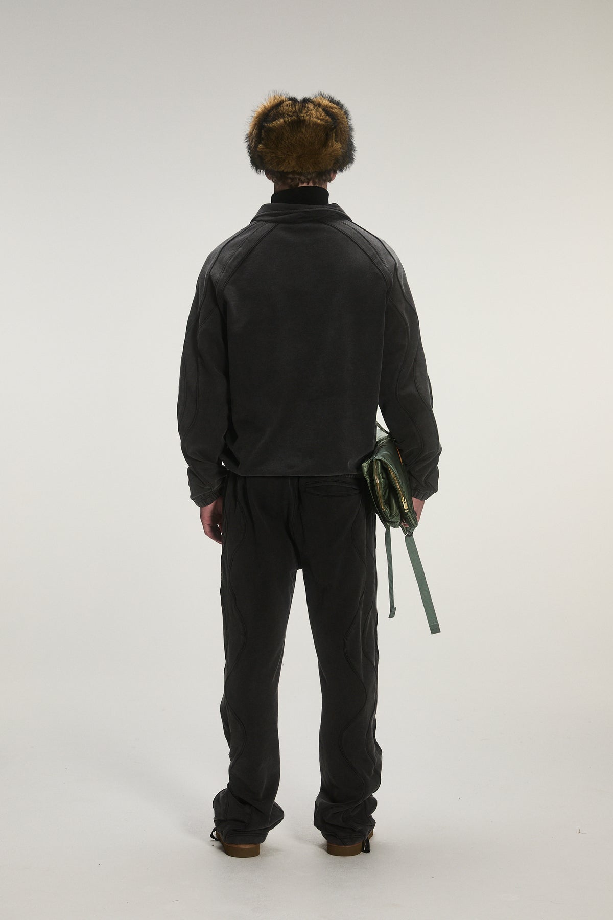 Male model wearing criminal damage tracksuit 