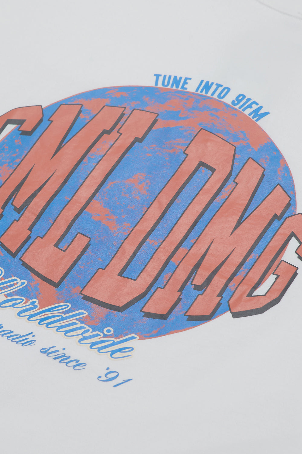 Close up of Criminal Damage logo on white t-shirt