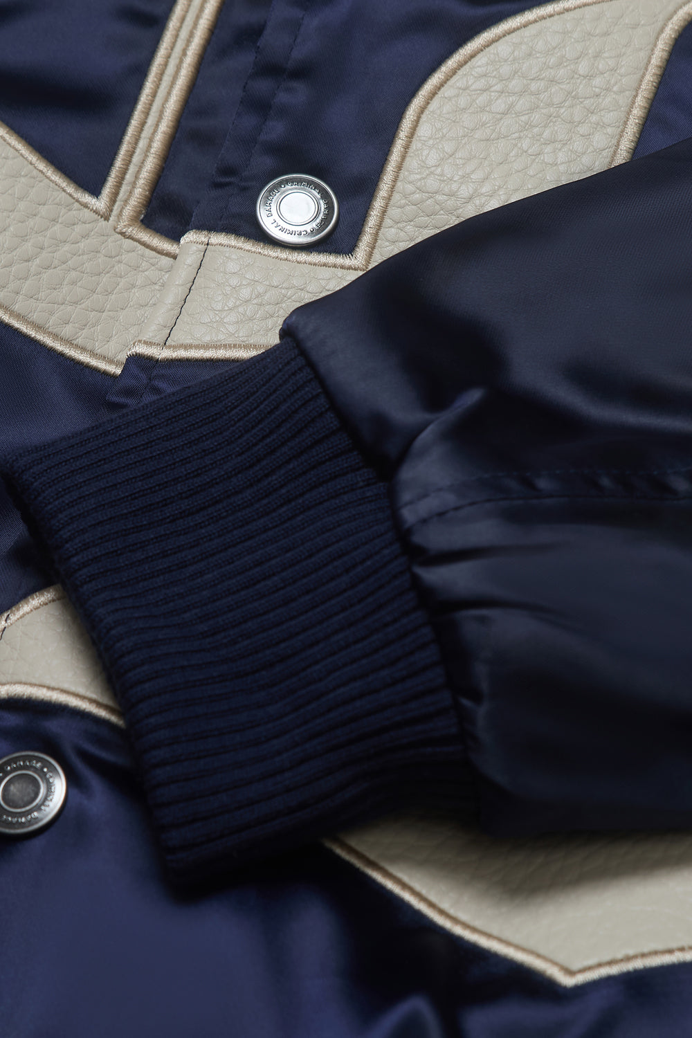 Close up of Criminal Damage jacket sleeve 